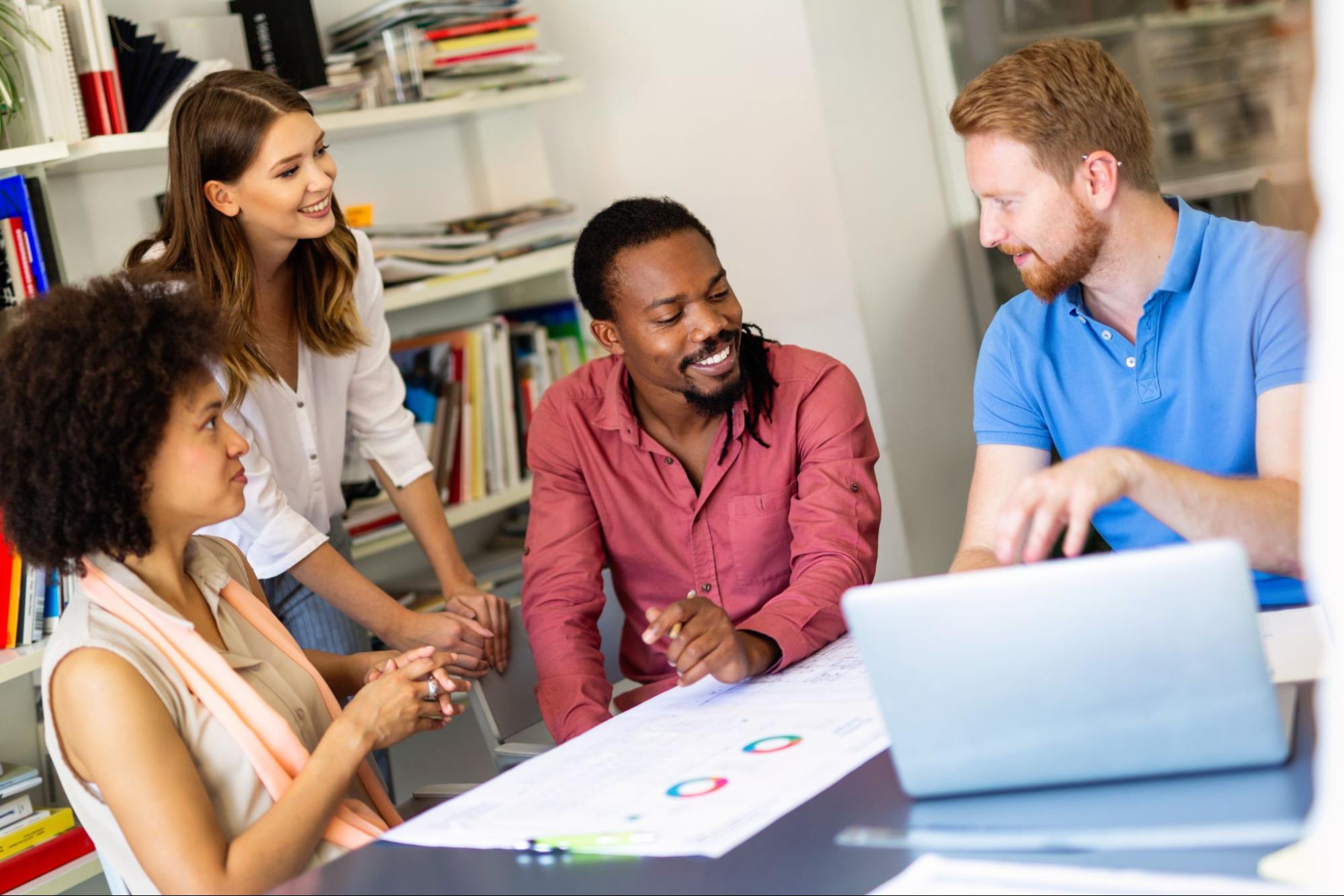 A team of professionals go over product plans and designs.