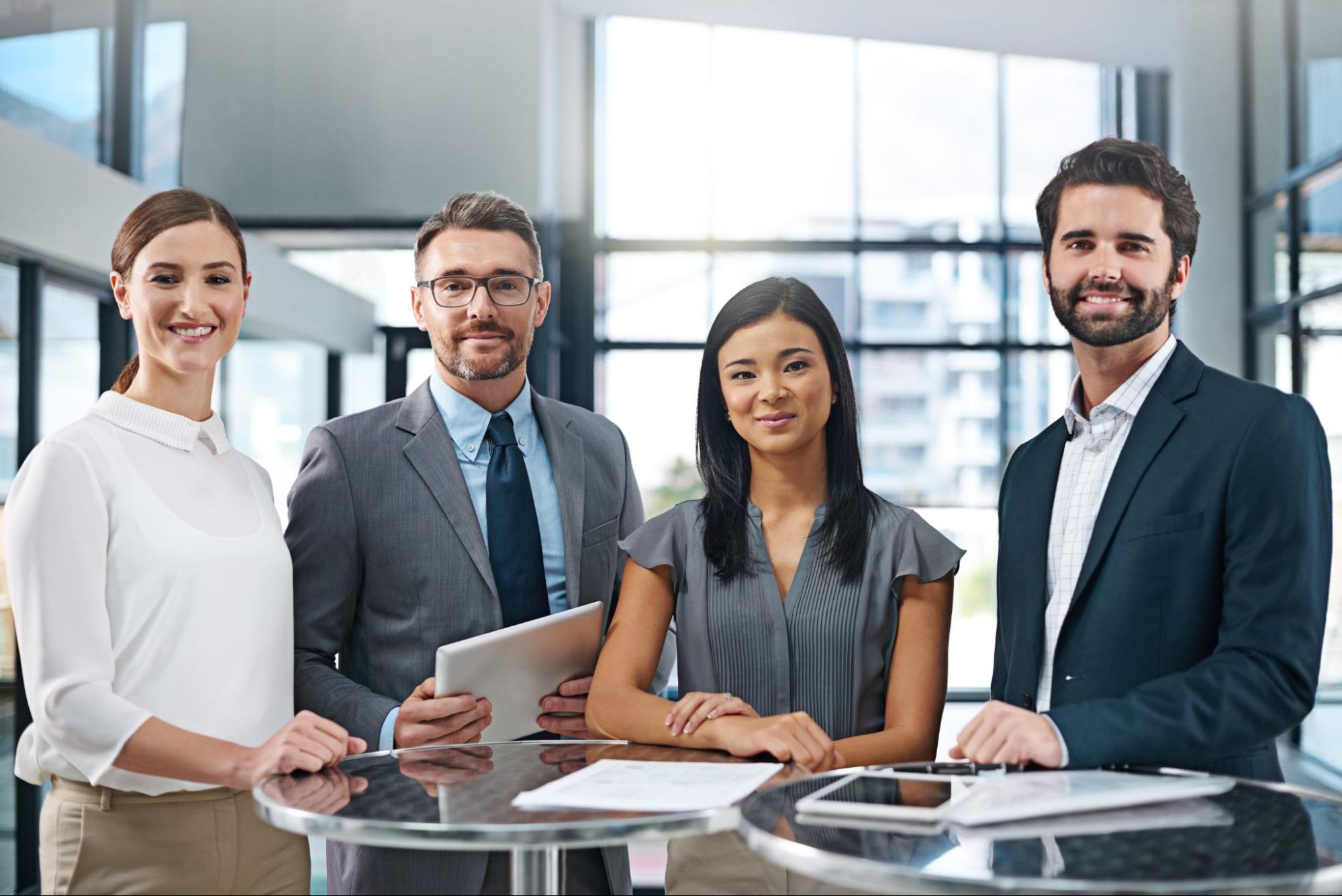 Confident looking business consultants smiling at the camera.